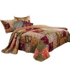 an image of a bed with colorful bedspread and comforter set on it