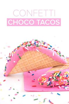 an ice cream cone with sprinkles and chocolate tacos on pink napkin