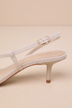 Summer just wouldn't be the same without the Schutz Heloise Oyster Beige Strappy Slingback Sandals! Woven fabric covers a square toe upper, a slender toe strap, and a long adjustable slingback strap that flows into a toe thong. 2" kitten heel. Cushioned insole. Non-skid leather sole. Genuine leather lining and sole. Balance man made material. Imported. Lulus | Heloise Oyster Beige Strappy Slingback Sandal Heels | Size 7. Cream Slingback Sandals For Spring Evening, Cream Slingback Pumps For Summer Party, Elegant Adjustable Slingback Sandals For Spring, Elegant Spring Adjustable Slingback Sandals, Adjustable Beige Slingback Sandals, Cream Slingback Sandals For Summer, Beige Ankle Strap Slingback Sandals, Chic Beige Slingback Sandals With Adjustable Strap, Beige Slingback Pumps For Summer Evenings