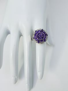 This Natural Amethyst Ring is made with thirteen round and six pear shape beautiful small amethyst Gemstones Cased in 92.5 Sterling Silver material. Gemstone : Natural Amethyst Ring weight : 6.73 grams Metal type : 925 Sterling silver Gemstones Shape :13 Round,6 Pear Gemstones Size : 3 mm Round ,3x4 mm Pear Gemstones count :19 Stones ⦿ Payment Policy :- We accept payment through PayPal. ⦿ Shipping Policy :- * All Items will Be Carefully packed and Shipped Through UPS, Aramex, DHL eCommerce, Indi Fine Jewelry Purple Cluster Rings, Cluster Amethyst Gemstone Rings, Amethyst Cluster Rings With Gemstone, Amethyst Cluster Gemstone Rings, Elegant Cluster Amethyst Ring, Purple Cluster Rings For Formal Occasions, Elegant Amethyst Cluster Ring, Elegant Purple Cluster Amethyst Ring, Formal Purple Cluster Rings