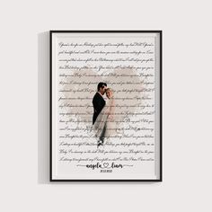 a framed photograph of a couple in front of the words on their wedding day, which are