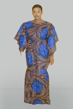 This dress is made out of African Print Wax Turtle Neck African Print Dress, White Dotted Background, Fitted Blue Maxi Dress With Cape Sleeves, Chitenge Maternity Dresses, Blue Maxi Dress With Cape Sleeves, Blue Fitted Maxi Dress With Cape Sleeves, African Maternity Dresses Pregnancy Africa, African Maxi Dress, Long Ankara Dresses For Pregnant Women