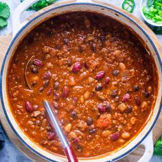 a large pot filled with chili and beans