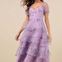 The Lulus Oh-So Stunning Purple Floral Organza Tiered Midi Dress Is Ready To Bring Extra Extravagant Vibes To Any Special Occasion! Sheer Woven Organza Boasts An Elegant Floral Print Throughout As It Shapes A Princess-Seamed Bodice, A Flirty Sweetheart Neckline, And Trendy Puff Sleeves (With Elastic At The Shoulders And Cuffs). The Fitted Waist Tops An A-Line Skirt That Boasts Chic Flouncy Tiers As It Falls To A Breezy Midi Hem. Hidden Back Zipper/Clasp. Details Shell: 100% Polyester. Lining: 97 Tiered Midi Dress, Lulu Dresses, Elegant Floral, Purple Floral, Purple Dress, A Line Skirt, Sweetheart Neckline, Puff Sleeves, A Line Skirts