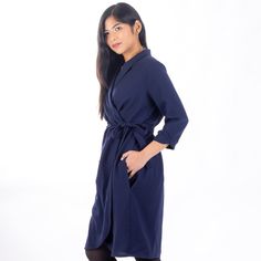 "Adeline is a wrap dress and top pattern designed for woven fabrics. Featuring dramatic diagonal pleats in the front and back, this is a wrap dress with a twist. Choose your level of detail, with either a shawl collar or a plain neckline. The sleeves come in short and 3/4 length, and can be plain, or pleated. Make the knee-length dress (which includes the option of in-seam pockets), or go for the top view with a peplum. The tie closure makes it easy to wear and easy to sew - no buttons or zips! Formal V-neck Faux Wrap Dress, Fitted Asymmetrical Shirt Dress For Work, Knee-length Wrap Dress For Office, Fall Wrap Dress For Work With Surplice Neckline, V-neck Faux Wrap Dress For Work, Semi-formal Long Sleeve Dress With Tie Waist, Semi-formal Long Sleeve Tie Waist Dresses, Elegant Asymmetrical Wrap Dress For Work, Asymmetrical Hem Wrap Dress For Spring Workwear