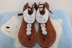 Unique Gift | Sandals | Gladiator Sandals | Greek Sandals | Beach Jewelry | Wedding Shoes | Leather Sandals | Custom | Mothers GiftAn elegant and authentic pair of African inspired beaded ladies sandals, with a unique and eye-catching design. 100% genuine leather. *100% genuine leather.Main Color - Multicolored. ✂⋯⋯ S I Z E  C H A R T ⋯⋯✂EU.........USA........UK.........CM............INCHES34..........3.5...........1.5.........22.3...........8.835..........4.5...........2.5........23............ Handmade White Ankle Strap Sandals, White Beaded Beach Sandals, White Beaded Sandals For Beach, Casual White Beaded Sandals, White Beaded Sandals With Round Toe, Handmade White Leather Sandals, White Handmade Leather Sandals, White Beaded Open Toe Sandals, Traditional White Sandals For Summer