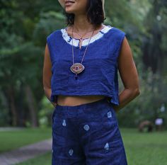 "Blue Indigo Tie Dye Sleeveless Top for Women 100% Double gauze cotton. Indigo natural dye with tie-dye detail on the side. Sizing: Made in one size to fits XS to M / US: 2/4/6/8 Measurement; Chest up to 37'' Pit to pit across 19'' Length top to bottom 15\" Armhole 18'' around. **Model is a size US 6 with 33\"bust 36\" hip. 164 cm tall.** Description: 100% Double Gauze cotton. Very soft and comfy. Indigo natural dye. With tie-dye detail on the sides. Simple round neck with a small slid in the mi Sleeveless Cotton Tops With Natural Dye, Sleeveless Cotton Top With Natural Dye, Indigo Sleeveless Top For Spring, Sleeveless Indigo Tops For Spring, Blue Cotton Sleeveless Tank Top, Blue Cotton Sleeveless Top, Casual Sleeveless Top With Natural Dye, Casual Sleeveless Eco-friendly Top, Blue Tops With Natural Dye