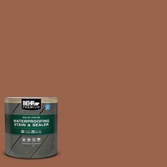 the behr paint color is dark purple and has a brown tin with white lettering on it