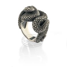 "The Snake Ring is not just an accessory; it's a declaration of your inner strength and resilience, reflecting the primal energy and transformative power that the snake represents. Often associated with mystery and duality, the snake symbolizes the shedding of old skin, signifying rebirth and renewal. Model name: \"Silver Snake\". Collection: \"Majestic Wildlife\". Material: 925 Sterling Silver. Weight: 39 gr. Color: Silver. Size: 5 ¾. - 13 ¾. The snake, an ancient symbol of renewal and transformation, represents shedding past burdens and embracing new beginnings. This ring embodies courage, growth, and the power to move forward with strength and resilience. For an added touch of personalization, we offer engraving services. Have your initials, a special date, or a meaningful message inscr Silver Snake Ring, Old Skin, Snake Ring Silver, Meaningful Messages, Snake Ring, Ancient Symbols, Ring For Men, The Snake, Inner Strength