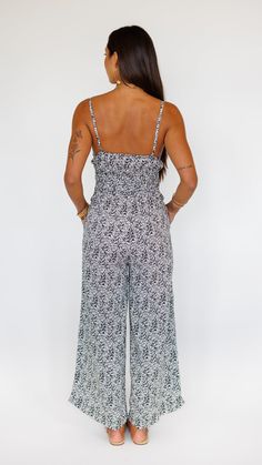 Stand out in this stunning jumpsuit, made to flow with buttery soft rayon and an exaggerated wide pant leg. Features adjustable straps and a gentle smocked waist to flatter. ** Our Model is 5'8" and wearing a size SMALL. ** Fabric and Care Instructions: *100% Rayon *Hand wash cold * Line Dry Chic Rayon Jumpsuits And Rompers For Spring, Spring Strapless Jumpsuit With Elastic Waistband For Loungewear, Chic Maxi Length Jumpsuits And Rompers With Elastic Waistband, Bohemian Jumpsuits And Rompers With Smocked Back For Spring, Chic Spring Jumpsuit With Smocked Bodice, Sleeveless Rayon Jumpsuits And Rompers For Spring, Bohemian Jumpsuits And Rompers With Elastic Waistband For Spring, Bohemian Spring Jumpsuits And Rompers With Elastic Waistband, Chic Jumpsuit With Smocked Bodice For Day Out