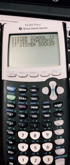 a calculator sitting on top of a desk next to another calculator