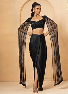 Black Dhoti Skirt Set Quench A Thirst - Fabilicious Fashion Net Cape Dress Indian, Dhoti Skirt Outfits With Cape, Festive Fitted Pre-draped Saree For Gala, Glamorous Black Pre-draped Saree, Elegant Festive Georgette Skirt, Elegant Black Silk Pre-draped Saree, Elegant Draped Skirt For Festive Party, Elegant Draped Skirt For Party And Festive Season, Glamorous Black Fitted Pre-draped Saree