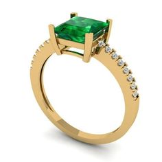 a gold ring with an emerald and diamonds