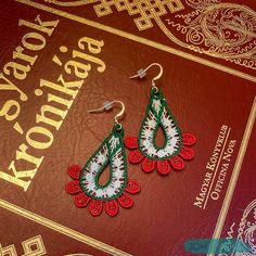 Pay a tribute to your Hungarian heritage with these beautiful handmade embroidered lace earrings by JOHANNIKA. Our intricate teardrop earrings come with silver plated ear wires and plastic backings for added safety. They are lightweight and sure to complement your outfit. Wear them with a casual, modern attire just for fun, or save them for that special event! Our jewelry can be hand washed, if necessary. These JOHANNIKA Hungarian tricolor earrings come beautifully wrapped and can include a spec Traditional Embroidered Drop Earrings, Traditional Handmade Teardrop Earrings For Gift, Traditional Handmade Christmas Jewelry, Floral Nursery Decor, Flower Mobile, Lace Necklace, Lace Earrings