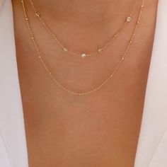 Attached layers, includes everything pictured Material: gold plated brass, crystals Length: 16" + 3" extension IMPORTED Delicate Gold Charm Necklace With Diamond Accents, Adjustable Gold Necklaces With Diamond Accents, Delicate Layered Gold Jewelry, Gold Necklaces With Diamond Accents For Everyday, Everyday Gold Necklaces With Diamond Accents, Everyday Gold Crystal Necklaces With Adjustable Chain, Gold Crystal Necklaces With Adjustable Chain For Everyday, Gold Crystal Necklace With Adjustable Chain For Everyday, Elegant Gold Crystal Necklaces For Layering