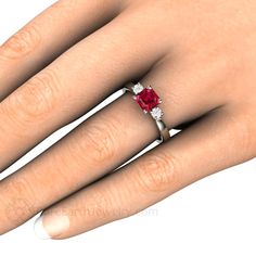 A gorgeous 3 stone Ruby and diamond ring available in your choice of 14K or 18K White, Yellow or Rose Gold or Platinum. At the center is a 1.10ct lab grown Ruby in an unique asscher cut. Two sparkling conflict free diamonds surround it, .14cts total weight. So pretty! Ruby is the birthstone for July. This ring would make a beautiful engagement ring. A matching wedding band is available. Inquire for pricing. Lab grown Rubies are physically, chemically and optically identical to natural Rubies. Th Elegant Three Stone Red Diamond Ring, Elegant Three-stone Red Diamond Ring, Elegant Red Three Stone Diamond Ring, Elegant Red Three-stone Diamond Ring, Red Three-stone Diamond Promise Ring, Red Three Stone Diamond Promise Ring, Red Three Stone Diamond Ring For Promise, Elegant Three Stone Diamond Ruby Ring, Elegant Red Three Stone Birthstone Ring