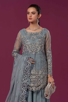 Bluish Grey Embroidered Maria B Luxury Formal Pakistani Salwar Suit ensemble the epitome of grace and elegance with sequins, thread embroidery, and pearl detailing. Delivery: 7 Business Days Detailed Description: SKU: PB683 Detailing: Embroidery, Threads Color: Grey Fabric: Net, Organza Design: Fully Embroidered dress Event: Festive, Party wear Formal Floor-length Sets With Pearl Embroidery, Embellished Long Sleeve Salwar Kameez For Party, Formal Festive Lehenga With Pearl Embroidery, Embellished Sharara For Formal Occasions, Embellished Semi-stitched Sets For Eid, Embellished Sets For Eid Reception, Embellished Sets For Reception On Eid, Formal Semi-stitched Dress With Pearl Embroidery, Elegant Pearl Embroidered Fabric For Eid