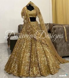 Made to Order/Measurement/Custom Order Lehenga - Color : Golden - Fabric : Embroidered Net - Fully flared paneled lehenga - Embroidered  Blouse -  Net Dupatta with Gold Border - Drawstring closure with Tassels - - It can be customize in any design or size  PLEASE NOTE: BUYERS ARE RESPONSIBLE FOR ANY CUSTOMS AND IMPORT TAXES THAT MAY APPLY. This is a made to order product. If you opt for 'Made To Measurement Option', we will provide a measurement template and you can share the measurements likewise. If you want to opt for 'Standard Size', Please refer to the size chart provided in the listing. Shipping: Standard Shipping is done by DHL ecommerce and it mostly takes 2 to 3 weeks to deliver after dispatch. Express Shipping is done by DHL express and it mostly delivers within a week after disp Fitted Gold Gown For Designer Wear, Fitted Lehenga With Mirror Work For Festive Season, Sequin Embellished Dupatta For Navratri, Fitted Gold Saree With Mirror Work, Fitted Sequin Dupatta For Navratri, Gold Saree With Mirror Work, Fitted Gold Gown For Navratri, Fitted Gold Traditional Wear With Mirror Work, Gold Fitted Gown For Navratri