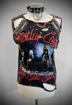 THE STITCHES Distressed Rock collection - This Mötley Crüe T-shirt is a handmade bleached crop top/t-shirt made with a brand new officially licensed band shirt. - Distressed Mötley Crüe  crop top/shirt - Safety pin unisex hand-made crop/tee - Material: Bleached cotton Measurements: Small size (Ready to ship) M, L, XL, XXL Sizes (Made to order: 10 working days process for made to order) Width (armpit to armpit)  S : 18 Inches  M: 20 Inches L: 22 Inches aXL: 24 Inches XXL: 26 Inches 3XL: 28 Inches Distressed Band Merch Top For Fans, Distressed Rock T-shirt For Streetwear, Edgy Acid Wash T-shirt For Alternative Fashion, Distressed Rock Style Crew Neck Top, Rock Style Distressed T-shirt For Streetwear, Distressed Rock Style T-shirt For Streetwear, Edgy Acid Wash Distressed T-shirt, Edgy Distressed Tops For Concert, Black Distressed Rocker Tops