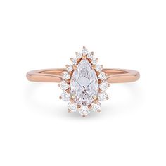 a rose gold engagement ring with a pear shaped diamond