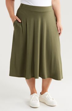 A flowy silhouette and an ultrasoft jersey fabrication create a comfy fit in this midi-length skirt that sways with every step you take. 30" length Elastic waist Unlined 92% polyester, 8% spandex Machine wash, tumble dry Imported Flowy Midi Skirt For Loungewear, Flowy Long Skirt For Loungewear, Flowy Lined Skirt For Loungewear, Relaxed Maxi Skirt With Elastic Waistband For Loungewear, Casual Maxi Skirt For Loungewear, Casual Flowy Skirt With Wide Waistband, Casual Skirt With Wide Waistband And Flowy Fit, Casual Flowy Maxi Skirt For Loungewear, Midi Length Rayon Bottoms With Elastic Waistband