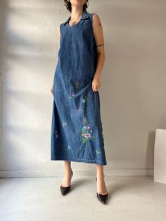 - Vintage Studio Ease denim maxi dress - Floral embroidery - Zipper up the side - Tagged 12 Bust: 20.5" Length: 51" Casual Floral Embroidered Maxi Dress, Casual Maxi Dress With Floral Embroidery, Embroidered Denim Dress In Medium Wash, Fitted Denim Maxi Dress, Fitted Casual Denim Maxi Dress, Casual Fitted Maxi Denim Dress, Embroidered Denim Dresses In Medium Wash, Medium Wash Embroidered Denim Dress, Casual Embroidered Cotton Maxi Dress