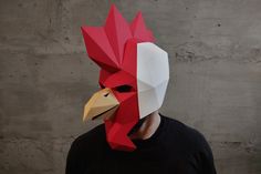 a man wearing a paper mask with a chicken on it