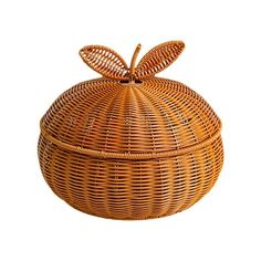 a round wicker basket with a bow on the top and bottom, sitting in front of a white background