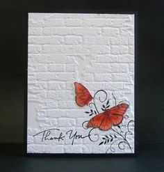 a card with two butterflies on it and the words thank you written in black ink