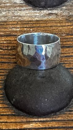 This wide band ring is forged from recycled sterling and hammered to give it a soft texture. Simple band rings can be a striking statement on your hand.  Hand polished to a shine it's a perfect minimalist piece I can give it a satin finish that will give it an organic texture.   Ring sizes  11. The band is 1/2" wide (13mm). Because wide bands require extra room to fit your finger properly. Ready to ship  size 11  polished band All jewelry comes gift boxed. Silver Ring Wedding, Wide Silver Ring, Simple Band, Etsy Wedding Rings, Wide Band Rings, Mens Ring, Unisex Ring, Ring Sizes, Extra Room