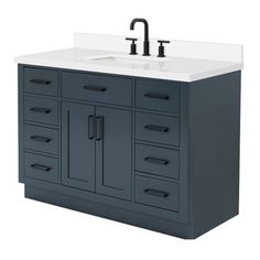 a bathroom vanity with a sink and faucet in it's center piece