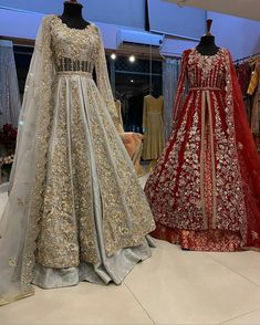 two gowns are on display in a store