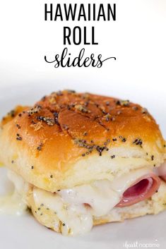 hawaiian roll sliders on a white plate with cheese and black pepper sprinkles