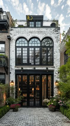 the entrance to a brick building with lots of windows