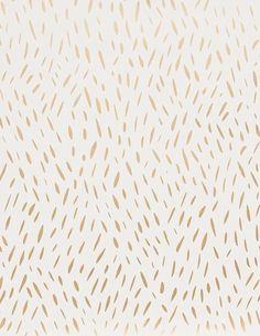 a white and gold wallpaper with lots of brown spots