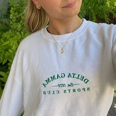 White crewneck, green embroidery, boyfriend fit. Our model is wearing size large (unisex). Size up for an oversized fit. 50% cotton, 50% polyester. Embroidery Boyfriend, Sorority Pr, Sorority Shirt Designs, Sorority Shirt, Sorority Sweatshirts, Green Sports, Green Embroidery, Sorority Designs, Sorority Tshirts