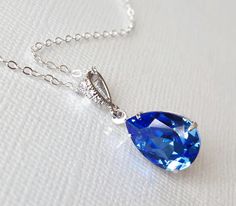 Blue Sapphire Teardrop Crystal Silver Wedding Bridal Bridesmaids Pendant Necklace with .925 Sterling Silver Chain. PLEASE READ ITEM DESCRIPTION and SHOP POLICIES before placing your order, and contact me with any questions! CHAIN is 18 inches (45.7cm) long, PENDANT is about 1 inch (2.5cm) long including bail. MATCHING EARRINGS: https://www.etsy.com/listing/127290938/blue-sapphire-crystal-earrings-114-blue?click_key=5dd31389ee30a5cb1912b518649cd5241b427635%3A127290938&click_sum=2f120624&ref=shop_ Blue Drop Jewelry For Wedding, Sapphire Drop Necklace For Wedding, Blue Teardrop Necklace For Wedding, Blue Pear-shaped Necklace For Formal Occasions, Crystal Wedding Necklace, Blue Wedding Jewelry, Necklace Sapphire, Bridesmaids Jewelry, Crystal Wedding Jewelry