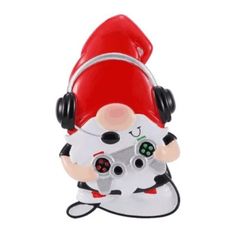 a toy with headphones on it and a santa clause holding a video game controller