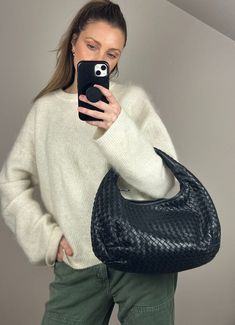 Bottega Veneta's Intrecciato leather hobo bag is the ultimate chic shoulder bag. This one is beautifully made from black leather with gunmetal hardware. When translated to English, intrecciato literally means braided. Bottega Veneta's staple technique involves strips of leather that are intertwined to create a woven pattern, which has become synonymous with the brand. Intrecciato Weave was introduced in the early 1970s and was first used on the brand's handbags. Bottega sell this bag new for £4660. Height: 24cm Width: 40cm Depth: 12cm This bag is in beautiful condition and comes with the original Bottega dust bag. To ensure you’re completely satisfied with your purchase, please refer to the images for the exact condition of the item. Bottega Veneta Hobo Bag, Bottega Bag, Gunmetal Hardware, Bottega Veneta Intrecciato, Hobo Shoulder Bag, Woven Pattern, Louis Vuitton Shoulder Bag, Leather Hobo Bag, Branded Handbags