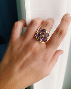 Round brass ring with Zircons and Amethyst stones. Measure : 20 mm x 23 mm Adjustable. * SHIPPING * Your order will be shipped within 1-3 business days from your purchase. You can choose between 2 shipping methods: STANDARD SHIPPING (without tracking) or REGISTERED MAIL (with tracking). Each chapeau atelier jewel is shipped in a gift box. Thank you for your visit. Luxury Amethyst Cabochon Ring For Collectors, Luxury Amethyst Cabochon Ring Collectible, Purple Multi-stone Amethyst Crystal Ring, 14k Gold Multi-stone Purple Amethyst Ring, Purple Gemstones In 14k Gold, Round Shaped, Amethyst Stones, Round Rings, Brass Ring, Amethyst Stone