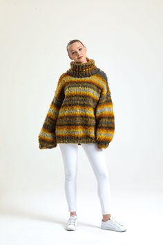 Introducing our newest addition to the wardrobe essentials: the Handmade Mustard Turtleneck Sweater Perfect for the chilly weather, this chunky and oversized jumper is designed for keep you warm and cozy all day long. The classic striped pattern adds a touch of style to this comfortable pullover. Made with high-quality knit material, this sweater for women is perfect for layering or wearing on its own. Upgrade your winter wardrobe with our Turtleneck Sweater and experience ultimate comfort and style. Order now and stay warm in this winter! Chunky Knit Cardigan Size Guide : Country/Size ... S/M  M/L  L/XL USA & CAN : .... 2 - 6  6 - 10  10 - 14 EU :  34-38 .... 38-42  42-46 UK & AUS :  6-10  10-14  14-18 Material: Premium acrylic wool blend extra soft yarn Cleaning: Machine washable at 30 d Oversized Multicolor Wool Sweater, Multicolor Wool Sweater, Yellow Relaxed Fit Winter Sweater, Oversized Cozy Yellow Sweater, Yellow Oversized Cozy Sweater, Oversized Yellow Cozy Sweater, Cozy Oversized Yellow Sweater, Oversized Yellow Chunky Knit Sweater, Cozy Oversized Knitting Pattern For Fall