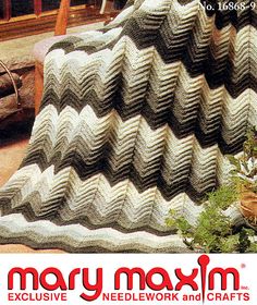 an advertisement for mary maxm's bedding and quilts, featuring a large chevroned blanket