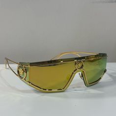 Versace Medusa Gold Tone Mirror Shield Sunglasses Condition: Like New, No Signs Of Wear Includes Designer Case Gold Anti-reflective Glass Sunglasses, Designer Gold Shield Sunglasses With Gradient Lenses, Modern Gold Shield Sunglasses With Glass Lenses, Modern Gold Shield Sunglasses With Glass, Designer Gold Shield Sunglasses For Formal Occasions, Luxury Gold Shield Sunglasses With Uva Protection, Luxury Gold Shield Sunglasses With Uv Protection, Designer Gold Sunglasses With Glass, Designer Gold Sunglasses With Glass Lenses