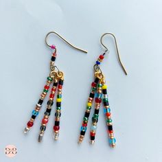 ♥ D E S C R I P T I O N: Stick earrings strung with glass beads. Multi-color cheerful, casual and cheap Three different color earrings. Can be for a gift, exchange small gifts in the office. they are suitable for both ladies and teenage girls and children. They are unpretentious to the toilet. The total length of the earrings is 5.5cm and 6cm. ♥ ♥ They can be made in a variety of colors. Please write to me if you want any color.♥ ♥  ♥ A T T E N T I O N: ♥ ♥ Please note that product colors may vary slightly due to differences in our device monitors♥ ♥  ♥ M A T E R I A L S:  Glass beads ♥ D I M E N S I O N S: Earrings size: ; ~2.16 inches (5,5cm); ~2.36inches (6cm) ♥ C A T E G O R Y: Jewelry/ Earrings/ Accessories ♥ C H E C K O U T  M O R E: theeight8jewelry.etsy.com ♥ L O V E * I T * & * B Multicolor Wire Wrapped Dangle Beaded Earrings, Multicolor Wire Wrapped Earrings For Gift, Multicolor Wire Wrapped Earrings As Gift, Multicolor Wire Wrapped Earrings With Round Beads, Glass Beaded Earrings With Dangling Beads For Gift, Multicolor Wire-wrapped Beaded Earrings For Gift, Multicolor Wire Wrapped Beaded Earrings For Gift, Multicolor Wire Wrapped Beaded Earrings As Gift, Multicolor Czech Glass Dangle Earrings