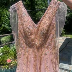 Mac Duggal Embellished V Neck Long Sleeve A Line Gown In Color Pink Champagne. Never Worn. Only Defect Is The Tag Was Removed From The Inside. Size 6! Originally $798. Pink V-neck Sequin Evening Dress, Pink Mother Of The Bride Dress For Evening Prom, Festive V-neck Prom Gown, Festive Pink Prom Dress, Festive Pink Prom Gown, Pink Floor-length Mother Of The Bride Dress For Party, Pink V-neck Mother Of The Bride Dress, Pink Evening Gown For Festive Occasions, Festive Pink Sequined Evening Dress