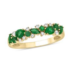 This stunning band features multi-shaped lab-created emeralds paired with diamonds to create an exceptional look. Sterling silver with 14K gold plate. The design features a row of multi-shaped lab-created emeralds Shimmering diamonds adds pops of sparkle 1/10 ct. t.w. of diamonds Green Cluster Jewelry With Diamond Accents, Lab Created Emerald, Peoples Jewellers, Diamond Band, Diamond Bands, Design Features, Emerald, Gemstone Rings, To Create