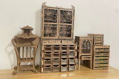 an assortment of wooden furniture sitting on top of a table