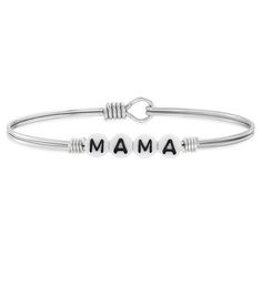 She's earned the title, now she'll have every excuse to use it. Our beautiful block- letter Nana Bracelet spells- out her signature nickname in a handmade glass letter bead bangle design that's perfect for gifting the lady you love. We updated this bestselling bracelet for grandma with white enamel text to define her style with extra- special detail. Easy hook and catch closure bracelet. Petite measures 6.5 in. Regular measures 7.5 in | She's earned the title, now she'll have every excuse to use Nana Bracelet, Bangle Design, Beaded Bangles Bracelets, Bead Bangles, Bangle Designs, Letter Beads, Delivery Gifts, Silver Bangle Bracelets, Block Lettering