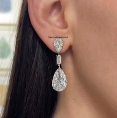 10K White Gold Teardrop Earrings, Pear And Baguette Cut Moissanite Diamond Women's Earrings, Bridal Wedding Earrings, Screw Back Earrings Detail about stones Moissanite & Simulated Stone: ----------------------------- ➠Stone Shape : Pear, Baguette ➠Stone Size : 15x10 MM, 9x6 MM, 6x3 MM ➠Weight: 16.3 TCW ➠Color: Colorless ➠Cut: Excellent ➠Clarity: VVS ✍This Listing's images are only for Imagin about this item. This is all our photography. If you place the order then the same item we can make it. Wedding Diamond Earrings With Baguette Cut, Wedding Diamond Earrings With Baguette Diamonds, Wedding Diamond White Earrings With Baguette Diamonds, White Baguette Cut Earrings For Wedding, Luxury Diamond White Teardrop Earrings For Wedding, Wedding Cubic Zirconia Earrings With Baguette Diamonds, Diamond Baguette Cut Bridal Earrings For Wedding, Diamond Bridal Earrings With Baguette Cut For Wedding, Pear-shaped Diamond Earrings For Wedding