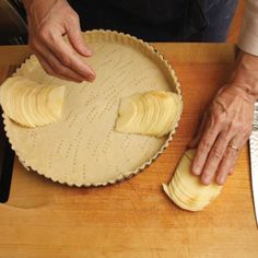 a person is cutting up some food on a table